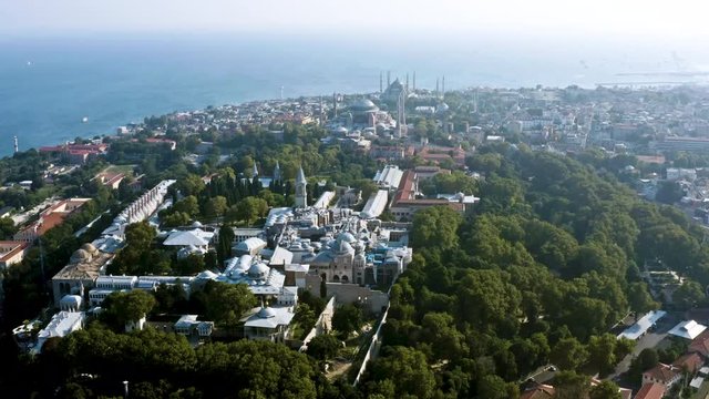 Topkapi Palace in Istanbul above view flying around the old historic Ottoman Empire capital panoramic aerial view feat. famous landmark museum and mosque in tourist district in Turkey HD and 4K 