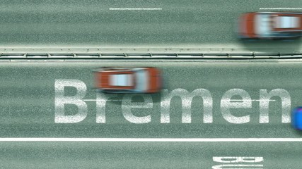 Aerial top-down view of the road. Cars reveal Bremen text. Travel to Germany conceptual clip