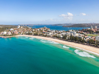 Naklejka na ściany i meble Panoramic high angle drone view of Manly Beach and the Sydney Harbour area. Manly is a popular suburb of Sydney, New South Wales, Australia. Famous tourist destination, easy to reach by ferry from CBD