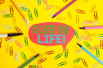 Obraz premium Word writing text De Clutter Your Life. Business photo showcasing remove unnecessary items from untidy or overcrowded places Flat lay above empty paper with copy space pencils and colored paper clips