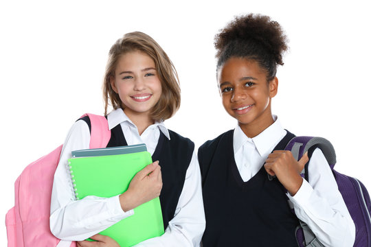 Happy girls in school uniform on white background