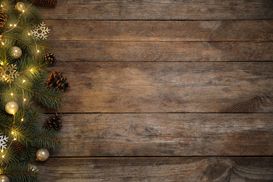 Christmas decoration on wooden background, flat lay. Space for text