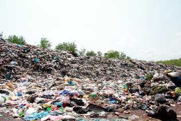 Mountain garbage, large and degraded garbage pile, Pile of stink and toxic residue, waste plastic bottles and other types of plastic waste site in trash dump or landfill. Pollution concept.