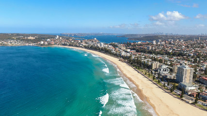 Panoramic high angle drone view of Manly Beach and the Sydney Harbour area. Manly is a popular suburb of Sydney, New South Wales, Australia. Famous tourist destination, easy to reach by ferry from CBD