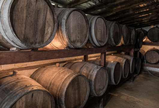 Wooden barrels with Cachaca in a destillery