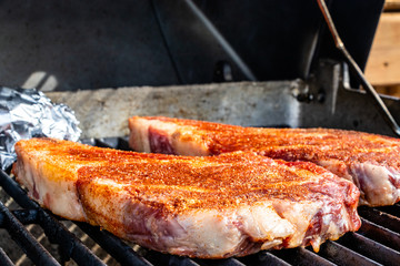Seasoned steaks Cooking on the grill. Calgary, Alberta, Canada