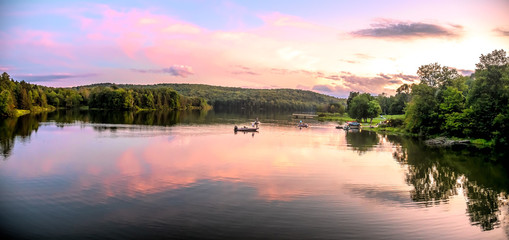 Sunset on lake with boat