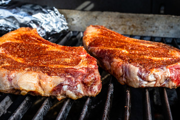Seasoned steaks Cooking on the grill. Calgary, Alberta, Canada