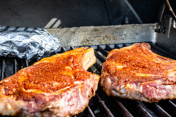 Seasoned steaks Cooking on the grill. Calgary, Alberta, Canada