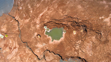 Sinkholes With water in dead sea aerial view 