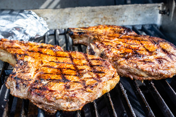 Seasoned steaks Cooking on the grill. Calgary, Alberta, Canada