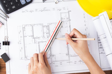 Construction planning with construction drawings and accessories,construction projects on paper. The concept of architecture,