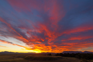 Orange and yellow colored clouds at sunset