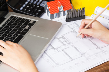 Construction planning with construction drawings and accessories,construction projects on paper. The concept of architecture,