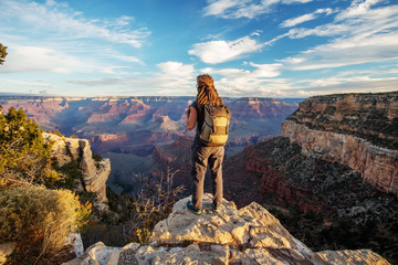 A hiker in the Grand Canyon National Park, South Rim, Arizona, USA. - obrazy, fototapety, plakaty