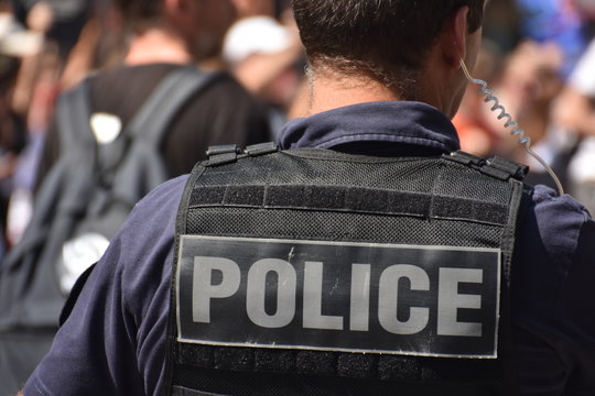 French policeman photographed from behind during a protest
