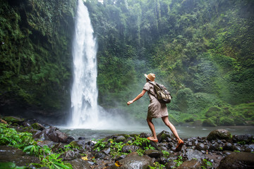 Woman near Nung Nung waterfal on Bali, Indonesia