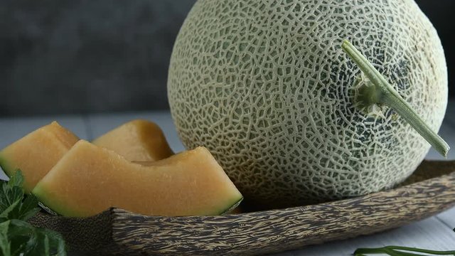 Whole and sliced of Japanese melons,honey melon or cantaloupe (Cucumis melo) Glass Of Melon Smoothie healthcare concept.