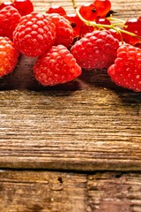 raspberries on wooden background