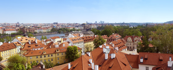 Naklejka premium Panorama of the old part of Prague from Charles bridge tower. Beautiful view on the bridges over the river Vltava. Old Town architecture.