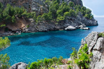 Fototapeta na wymiar The rocks in the Bay of Sa Colobra in Mallorca 