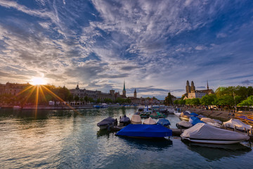Panoramic view of historic Zurich downtown with Fraumunster and Grossmunster churches at lake...