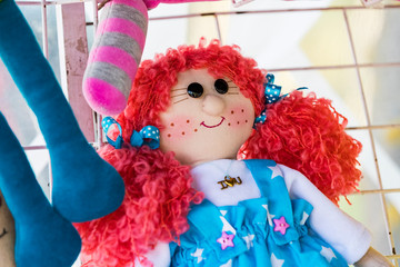 Souvenir doll made of handmade fabric photo taken close up