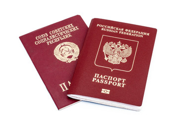 Passports of the Russian Federation and the Soviet Union on a white background.