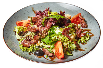 Salad with beef on a white background