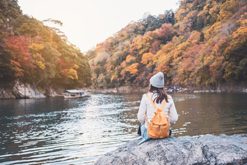 Young woman traveler looking beautiful landscape at arashiyama Japan, Travel lifestyle concept