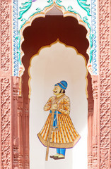 Ornate facade detail in Mughal style of old haweli in Pushkar old town, India