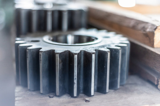The gear wheel after milling and grinding processing lie on the rack.