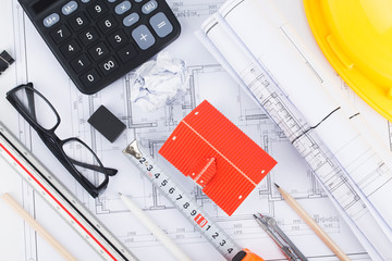 Construction planning with construction drawings and accessories,construction projects on paper....