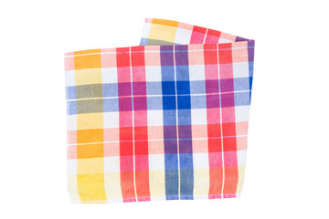 Closeup of a blue, white, red, yellow, and orange checkered napkin or tablecloth isolated on white background. Dishtowels are kitchen accessories.