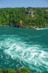 Niagara Falls, Ontario, Canada: An antique cable cars carries visitors across the Niagara River, over the Whirlpool Rapids.
