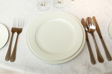 tableware standing on a white festive table