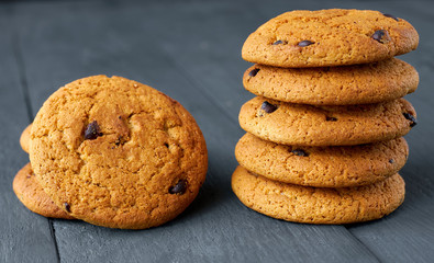 Chocolate cookies on a dark wooden table.
