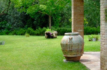 Decorative stone pot guarding the garden