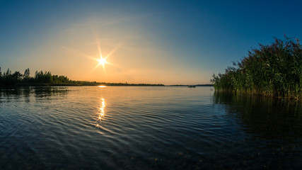 Fototapeta na wymiar Beautiful summer sunset over a lake