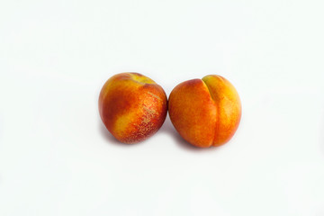 ripe nectarines isolated on white background