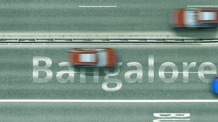 Overhead view of the busy car road with Bangalore text. Travel to India intro clip