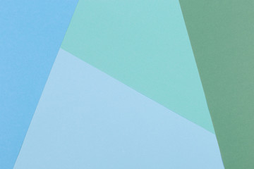Paper blue, green, pastel empty background, geometrically located. Color blank for presentations, copy space.