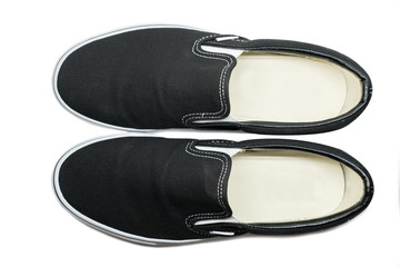 isolated top view of black slip on shoes