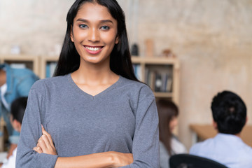 working creative asian woman dark skin portrait photo half body with meeting room office background