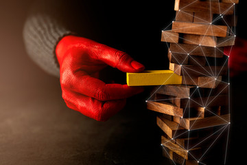 red hand businessman hand pullout wiiden vlock form tower business organize strategy ideas concept