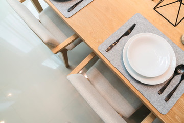 close up luxury tableware set with silver spoon and crystal glasses interior decoration background