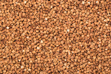 Macro Photo food buckwheat groats. Texture background grain buckwheat groats. Image food product porridge buckwheat grains