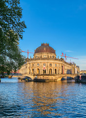Fototapeta premium Berlin, Germany - May 4, 2019 - The Bode Museum located on Museum Island in the Mitte borough of Berlin, Germany at dusk.