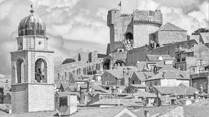 Mediterranean cityscape in black-and-white color - view of the roofs of the Old Town of Dubrovnik on the background on of the city walls and of the Minceta Tower, Adriatic coast of Croatia