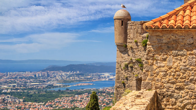 Summer mediterranean landscape - top view from the Klis Fortress on the city of Split, on the Adriatic coast of Croatia